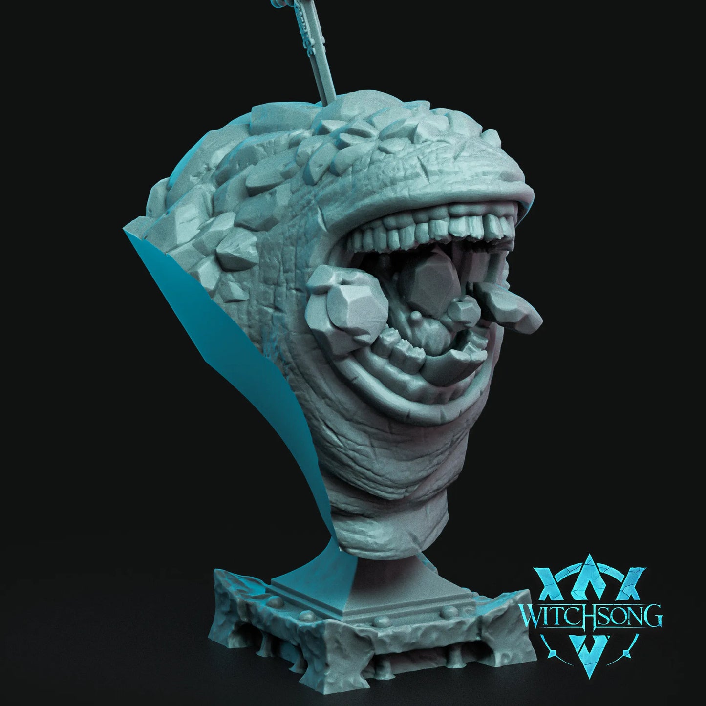 Detailed sculpture of a creature's head on a stand with 'Witchsong' branding.