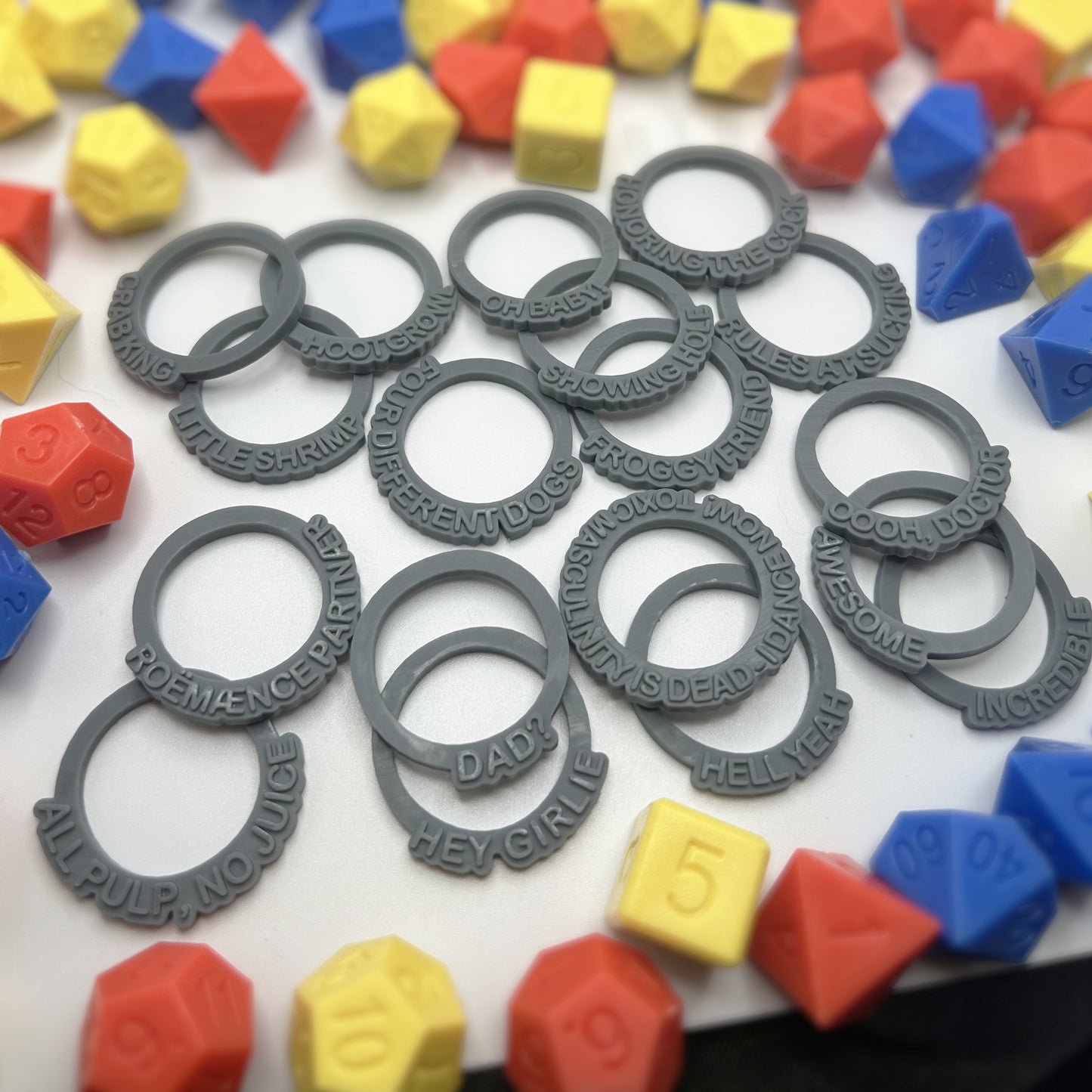 D20-inspired novelty status rings by Tattles Told 3D, featuring 18 dimensions for D&D TTRPG game accessories.