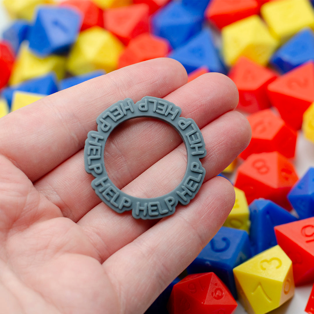 12 novelty status rings from Tattles Told 3D, D&D TTRPG game accessory featuring colorful, detailed fantasy-style rings.