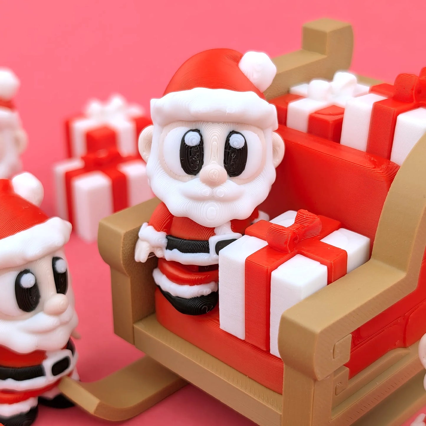 Miniature Flexi Santa with sleigh figurine by Tattles Told 3D, showing festive holiday decor with detailed Santa and sleigh design.