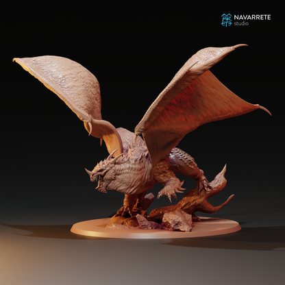 Miniature Cave Dragon from Tattles Told 3D, designed for tabletop gaming, shown in detailed sculpt with textured scales.