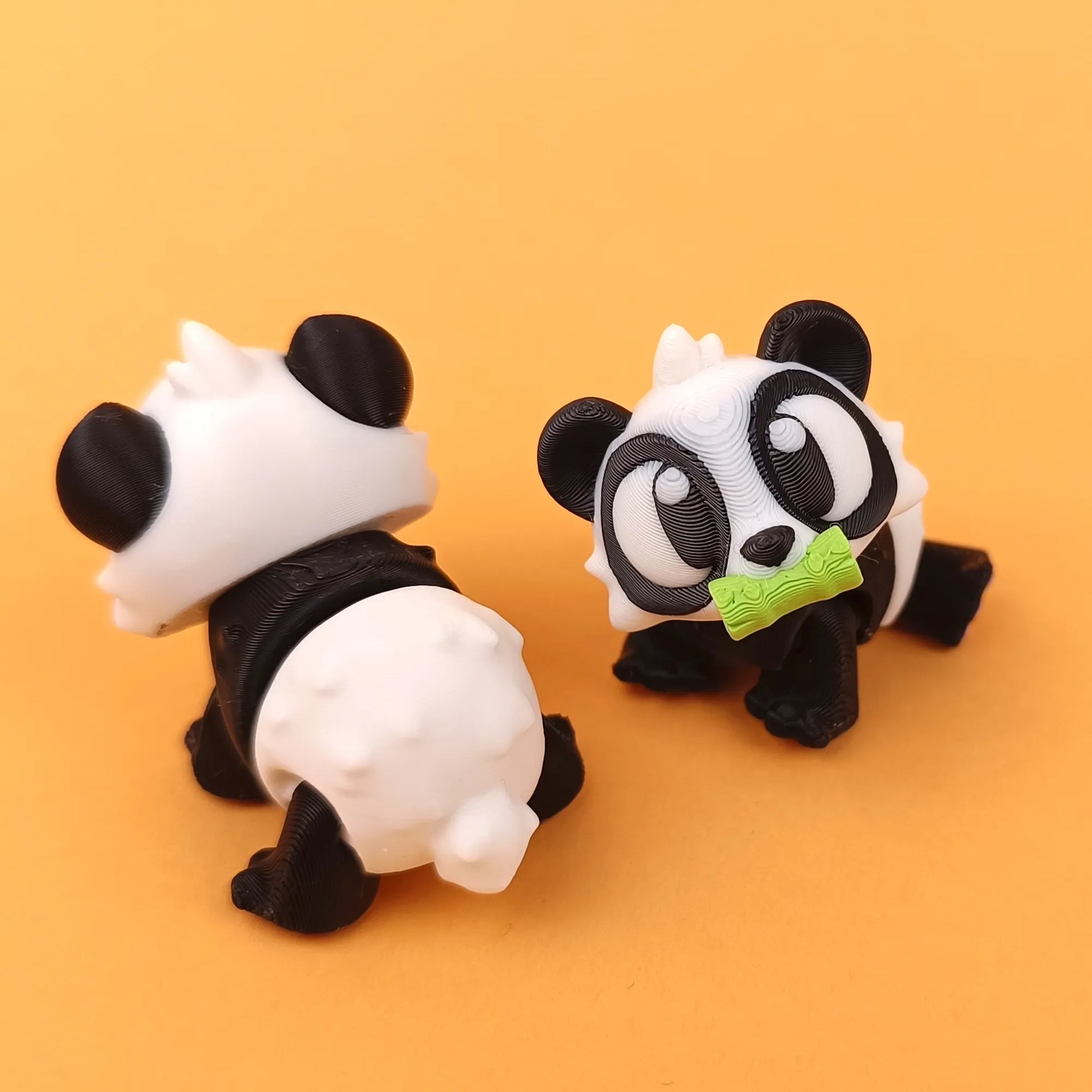 Miniature Flexi Panda by Tattles Told 3D featuring flexible limbs and detailed panda design in a vibrant, colorful style.