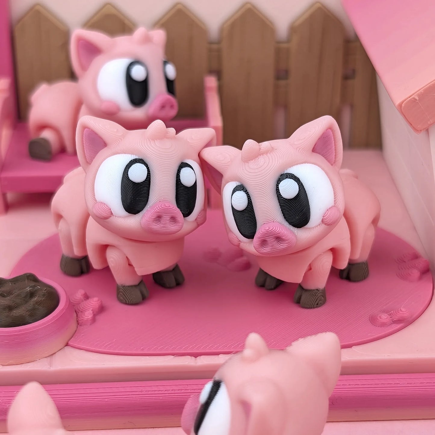 Miniature Flexi Piggy Playset by Tattles Told 3D featuring colorful, flexible pig figures on a playful background.