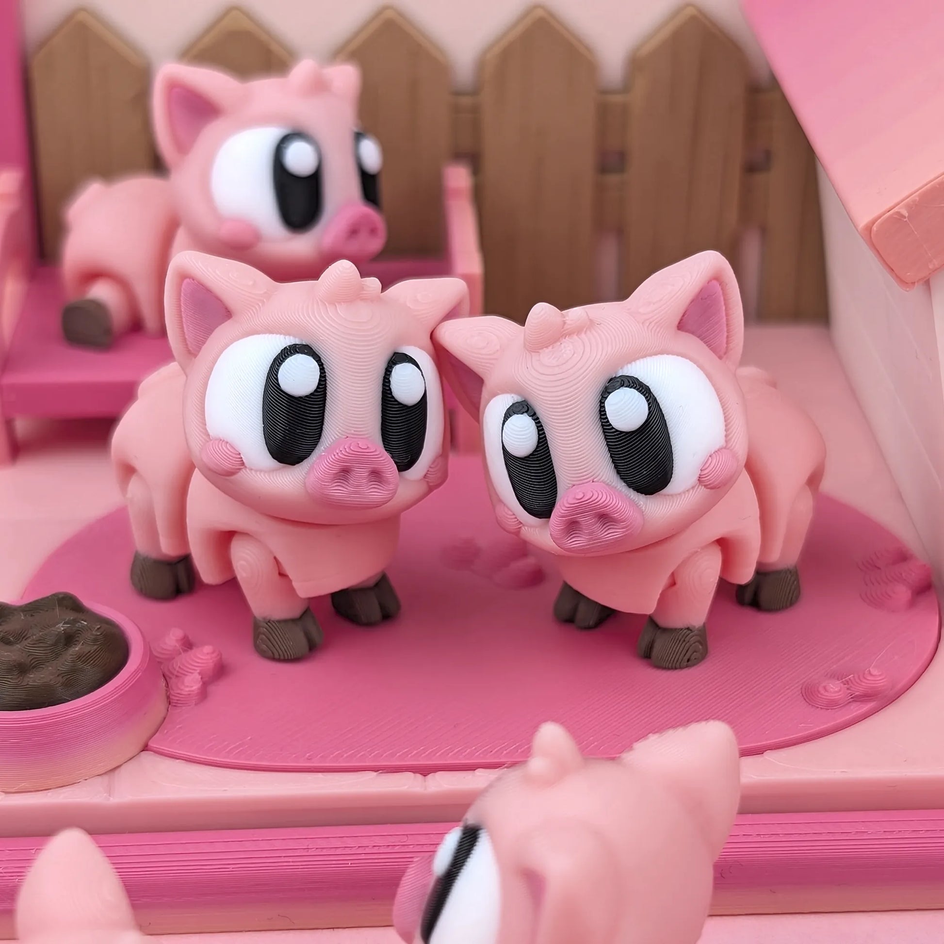 Miniature Flexi Piggy Playset by Tattles Told 3D featuring colorful, flexible pig figures on a playful background.