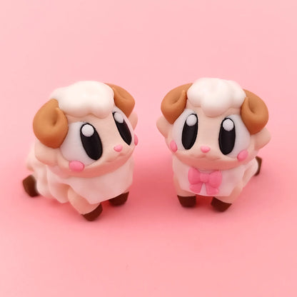 Miniature Flexi Sheep figurine by Tattles Told 3D, featuring a flexible, detailed sheep with textured wool and realistic features.