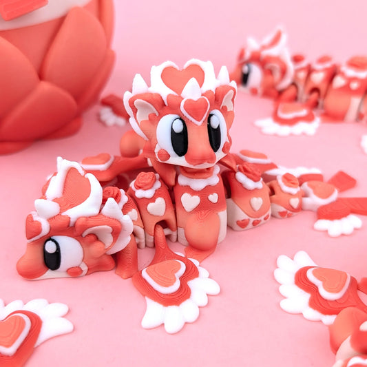 Miniature Flexi Heartseeker Mini Dragon with egg by Tattles Told 3D, featuring detailed dragon and egg design in a colorful, handcrafted style.
