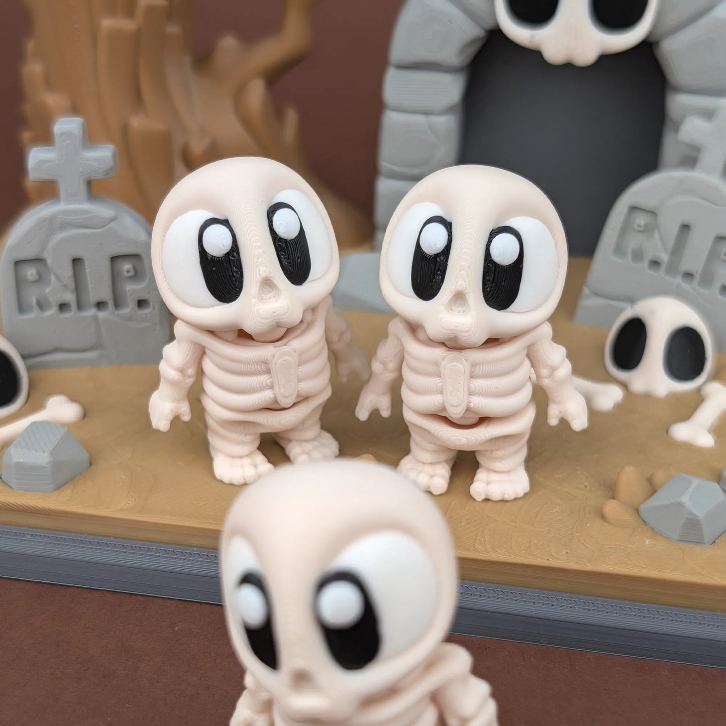 Mini skeleton figure from Tattles Told 3D's Miniature Skeleton & Graveyard Playset, suitable for Halloween or spooky dioramas.