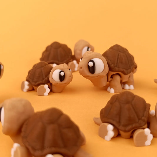 Miniature Tattles Told 3D Flexi Tortoise figurine with a detailed tortoise shell and realistic features.