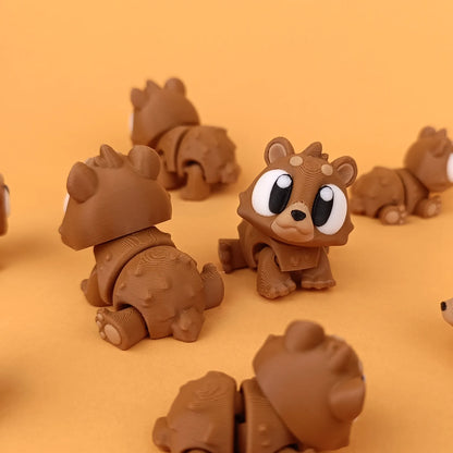Miniature Flexi Mini Bear by Tattles Told 3D featuring a cute, flexible bear figure on a neutral background.