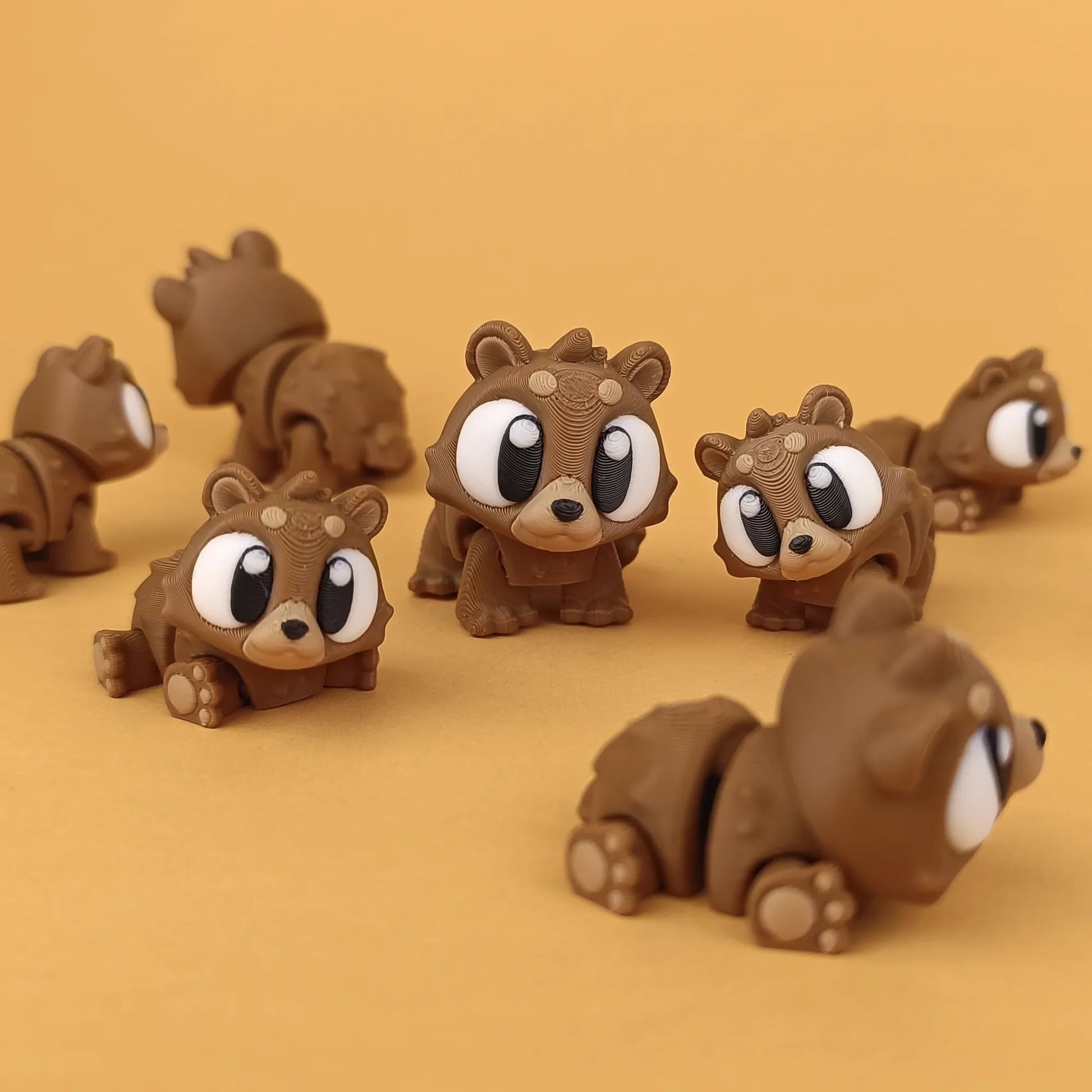 Miniature Flexi Mini Bear by Tattles Told 3D, featuring a cute, flexible bear figure with detailed fur texture and expressive eyes.