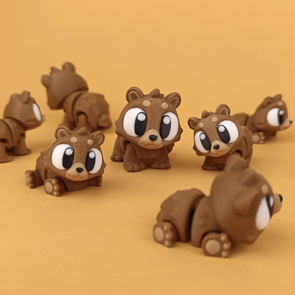 Miniature Flexi Mini Bear by Tattles Told 3D, featuring a cute, flexible bear figure with detailed fur texture and expressive eyes.