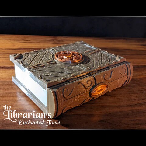 Small 3D printed miniature of The Mini Mini Tome gaming storage accessory by Tattles Told 3D, detailed and colorful.