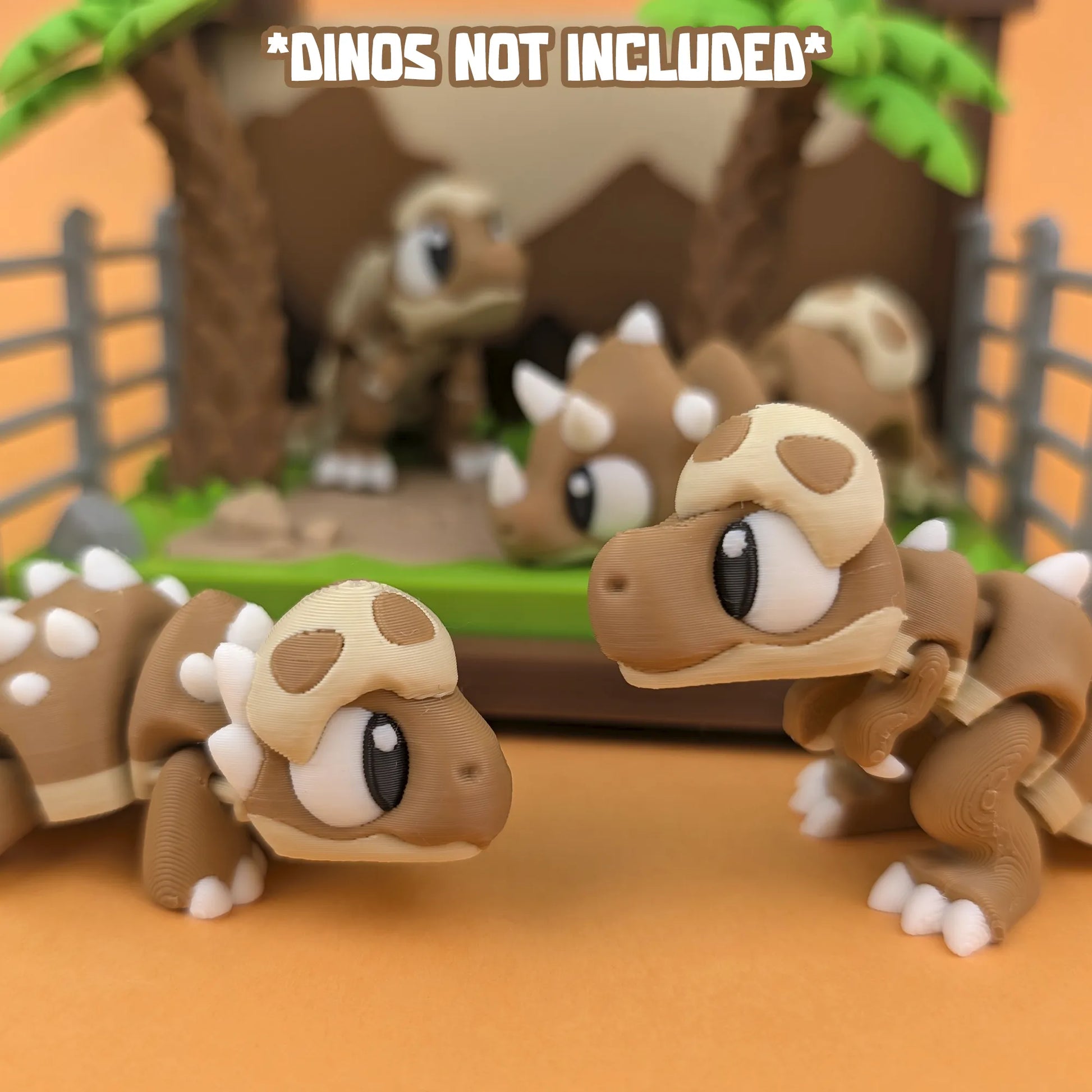 Miniature Jurassic World playset by Tattles Told 3D featuring detailed dinosaur figures and landscape elements.