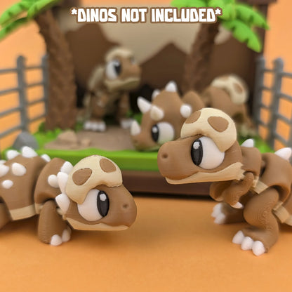 Miniature Jurassic World playset by Tattles Told 3D featuring detailed dinosaur figures and landscape elements.