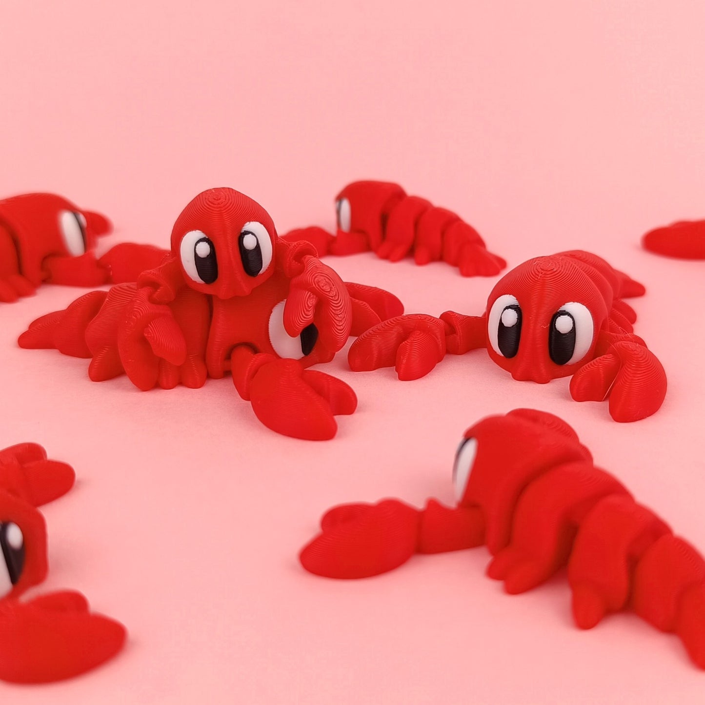 Miniature Flexi Lobster by Tattles Told 3D, detailed plastic lobster figure with articulated claws and textured shell.