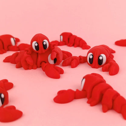 Miniature Flexi Lobster by Tattles Told 3D, detailed plastic lobster figure with articulated claws and textured shell.