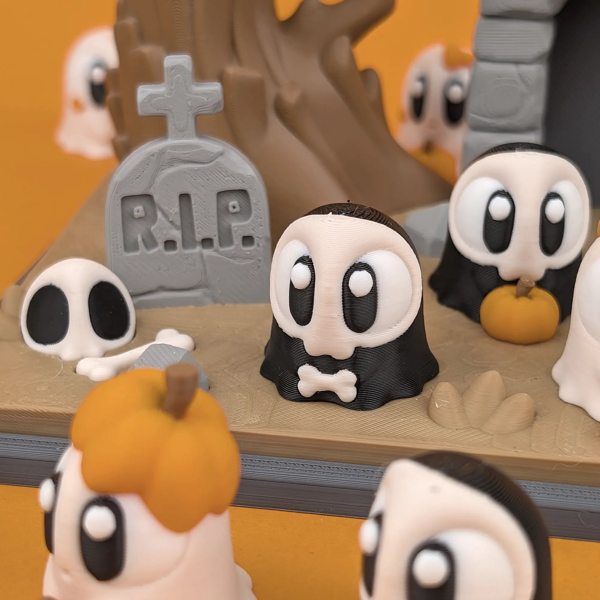 Miniature ghost and graveyard playset from Tattles Told 3D featuring tiny ghosts and spooky graveyard elements.