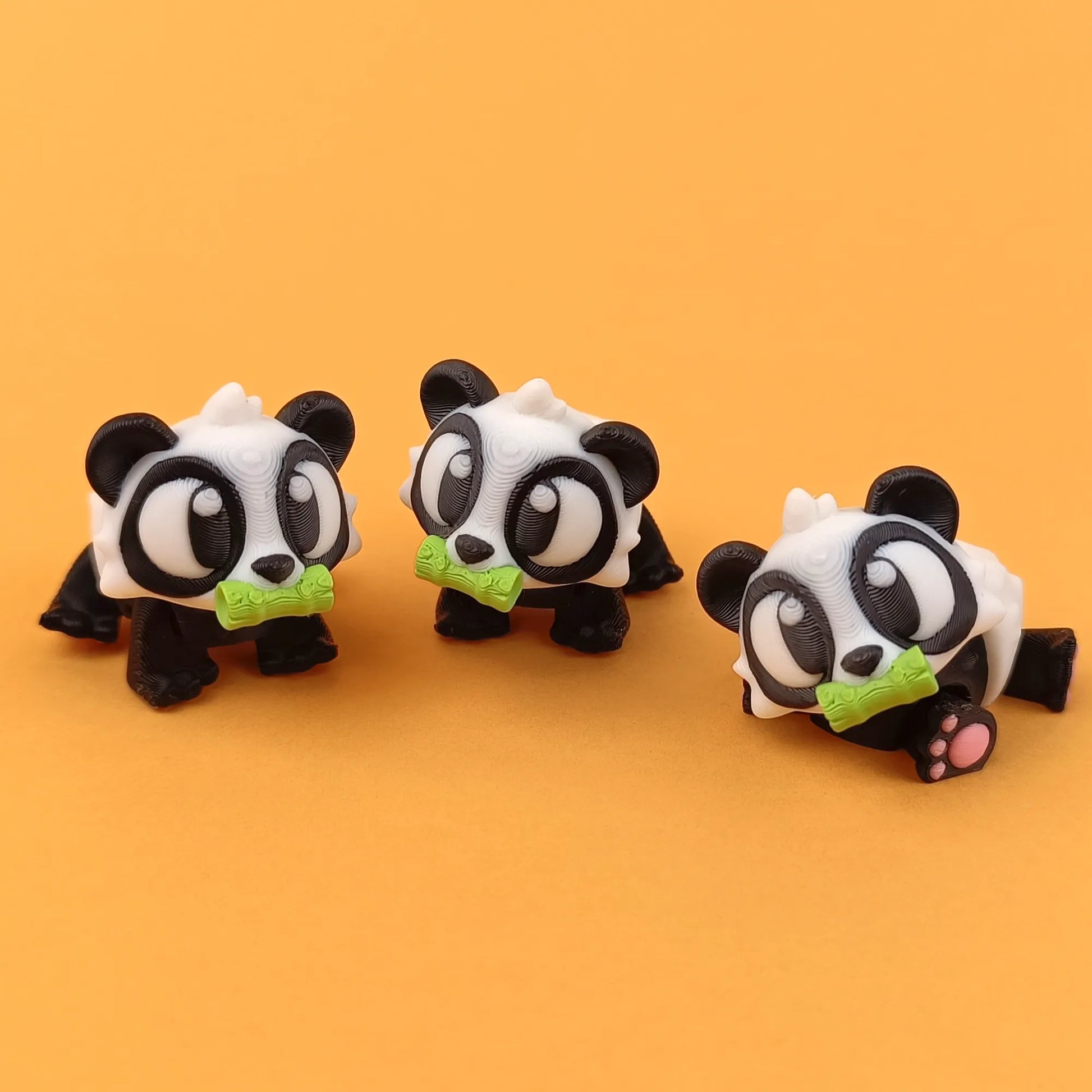 Miniature Flexi Panda toy by Tattles Told 3D featuring a cute panda design on a transparent background.