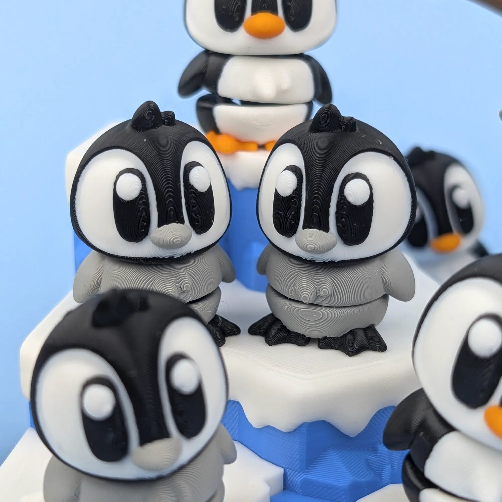 Miniature Flexi Penguin figure from Tattles Told 3D, part of the Playset, featuring a soft, flexible penguin with detailed features.