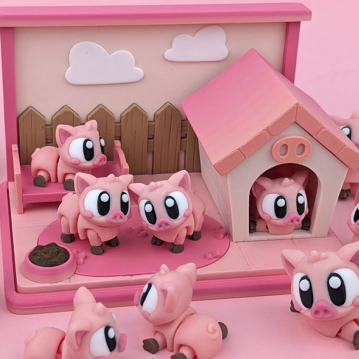 Miniature Flexi Piggy Playset by Tattles Told 3D featuring colorful piggy figures and playful accessories on a white background.