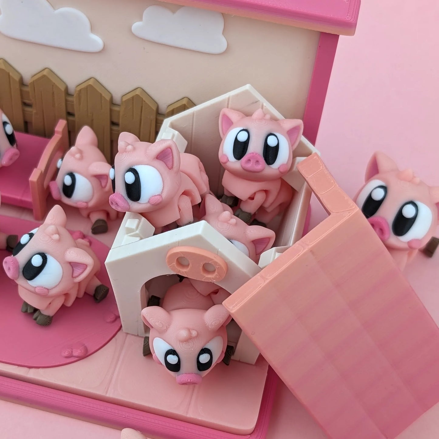 Miniature Flexi Piggy Playset by Tattles Told 3D featuring colorful piggy figures and playful accessories on a white background.