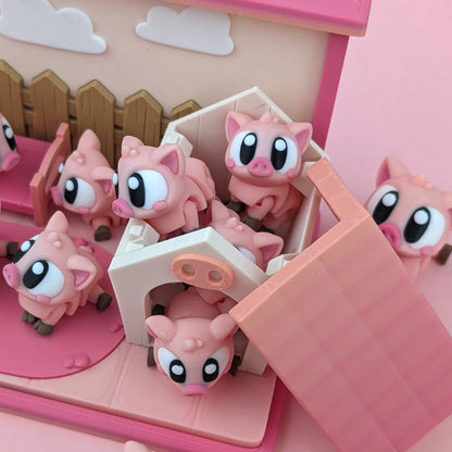 Miniature Flexi Piggy Playset by Tattles Told 3D featuring colorful piggy figures and playful accessories on a white background.