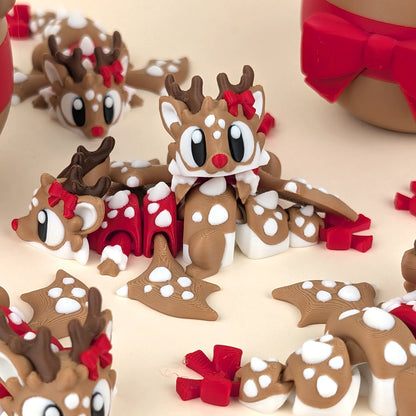 Miniature Flexi Reindeer with dragon and egg figurine by Tattles Told 3D, featuring colorful, detailed plastic character on a white background.