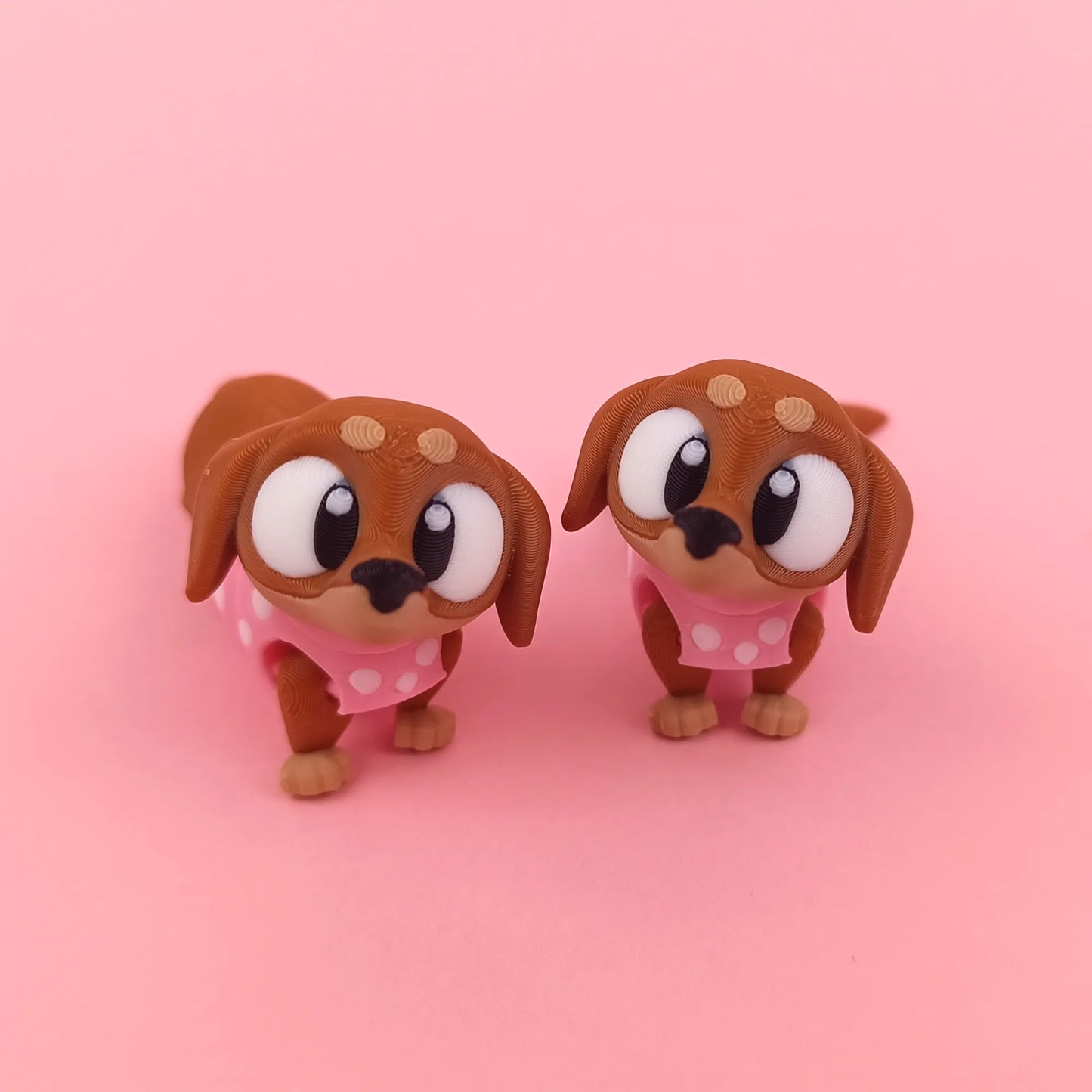 Miniature Flexi Sausage Dog by Tattles Told 3D, featuring a flexible, colorful 3D-printed plush toy with a playful design.