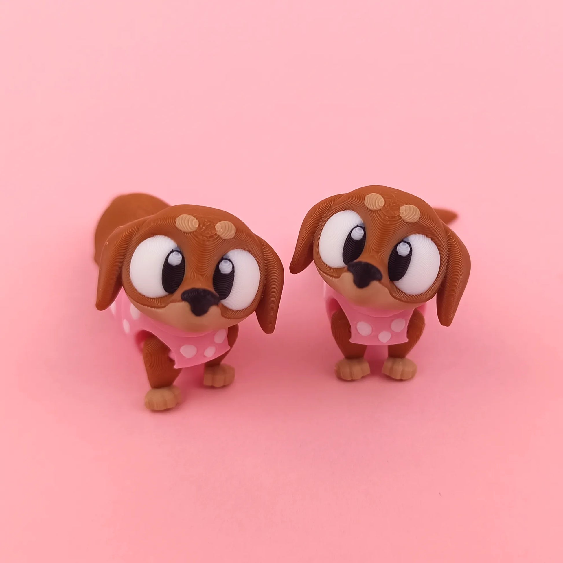 Miniature Flexi Sausage Dog by Tattles Told 3D, featuring a flexible, colorful 3D-printed plush toy with a playful design.