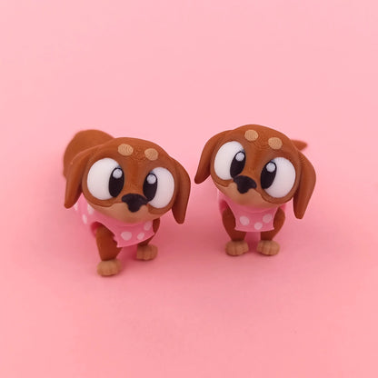 Miniature Flexi Sausage Dog by Tattles Told 3D, featuring a flexible, colorful 3D-printed plush toy with a playful design.