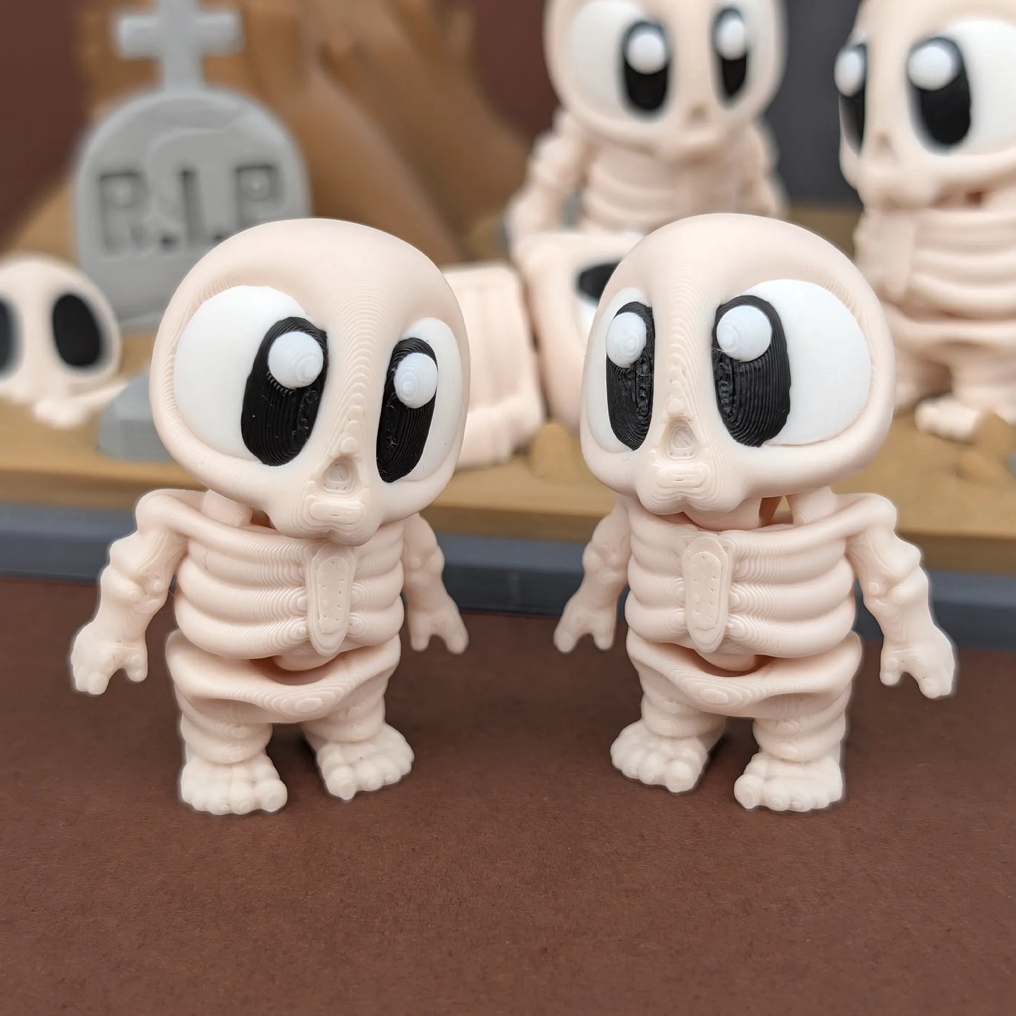 Miniature skeleton figure from Tattles Told 3D's Mini Skeleton & Graveyard Playset, shown in a spooky graveyard scene.