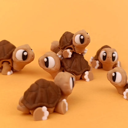 Miniature Flexi Tortoise by Tattles Told 3D featuring a detailed tortoise design with a flexible, textured shell and realistic features.