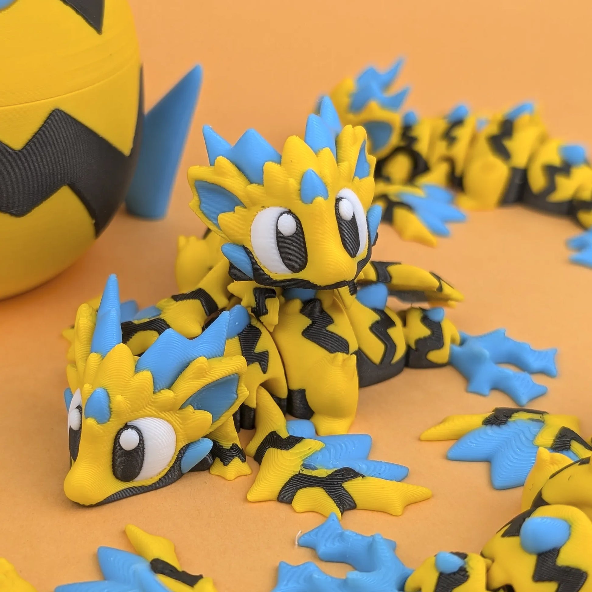 Miniature Flexi Wild Voltage Mini Dragon and Egg figure by Tattles Told 3D, featuring vibrant colors and detailed design.