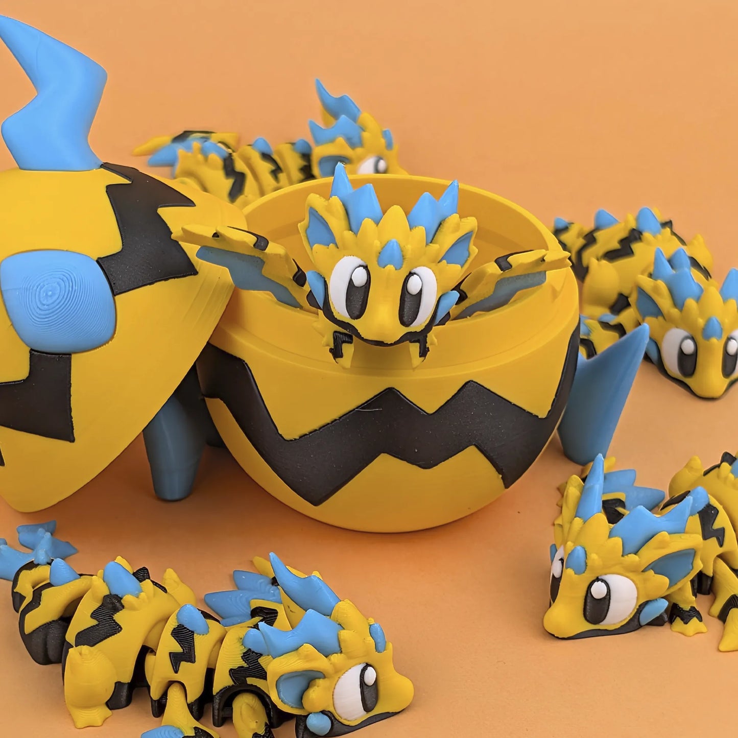 Miniature Flexi Wild Voltage Dragon and Egg by Tattles Told 3D, featuring colorful, detailed fantasy dragon and egg sculpture.