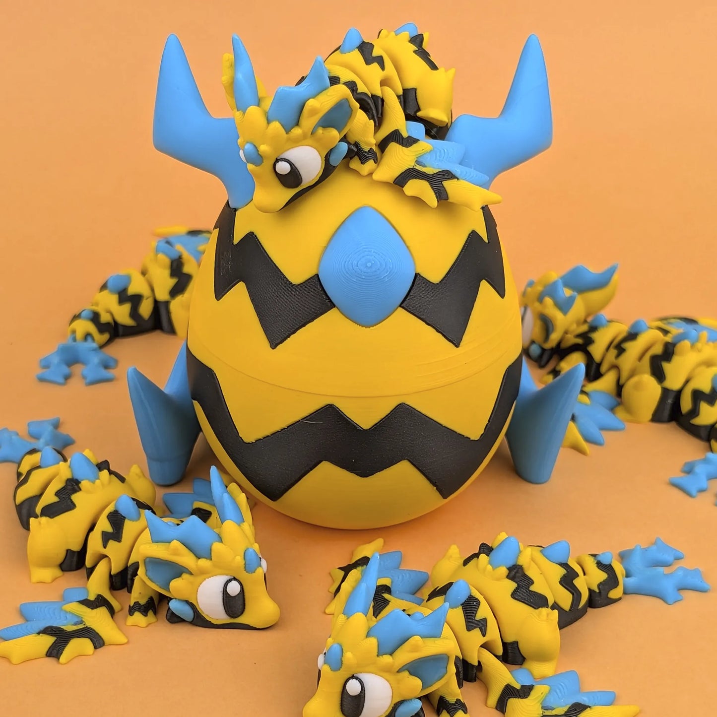 Miniature Flexi Wild Voltage Mini Dragon with Egg from Tattles Told 3D, detailed colorful fantasy creature.